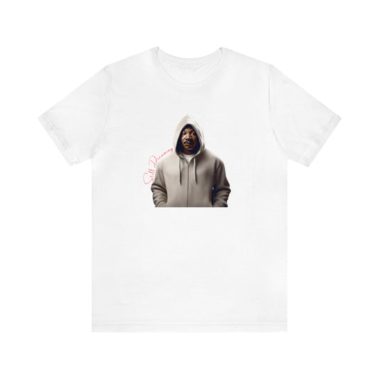 Still Dreaming Tribute Tee features MLK in a hoodie symbolizing resilience. A call to action Black History Month Gift Tee